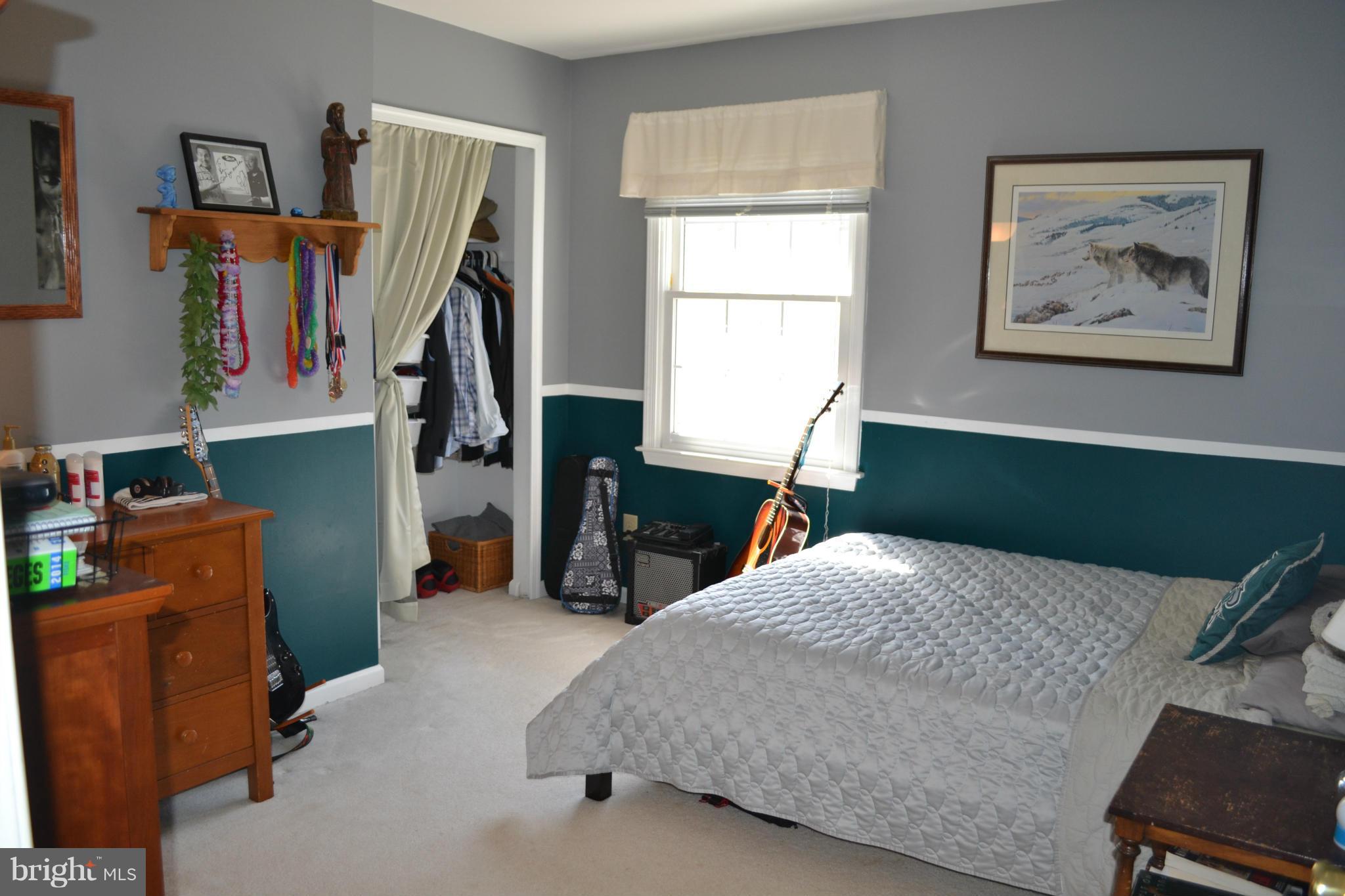 5901 Moore Road Marshall, VA 20115 - Photo 13 of 30 a bedroom with a bed and a bookshelf