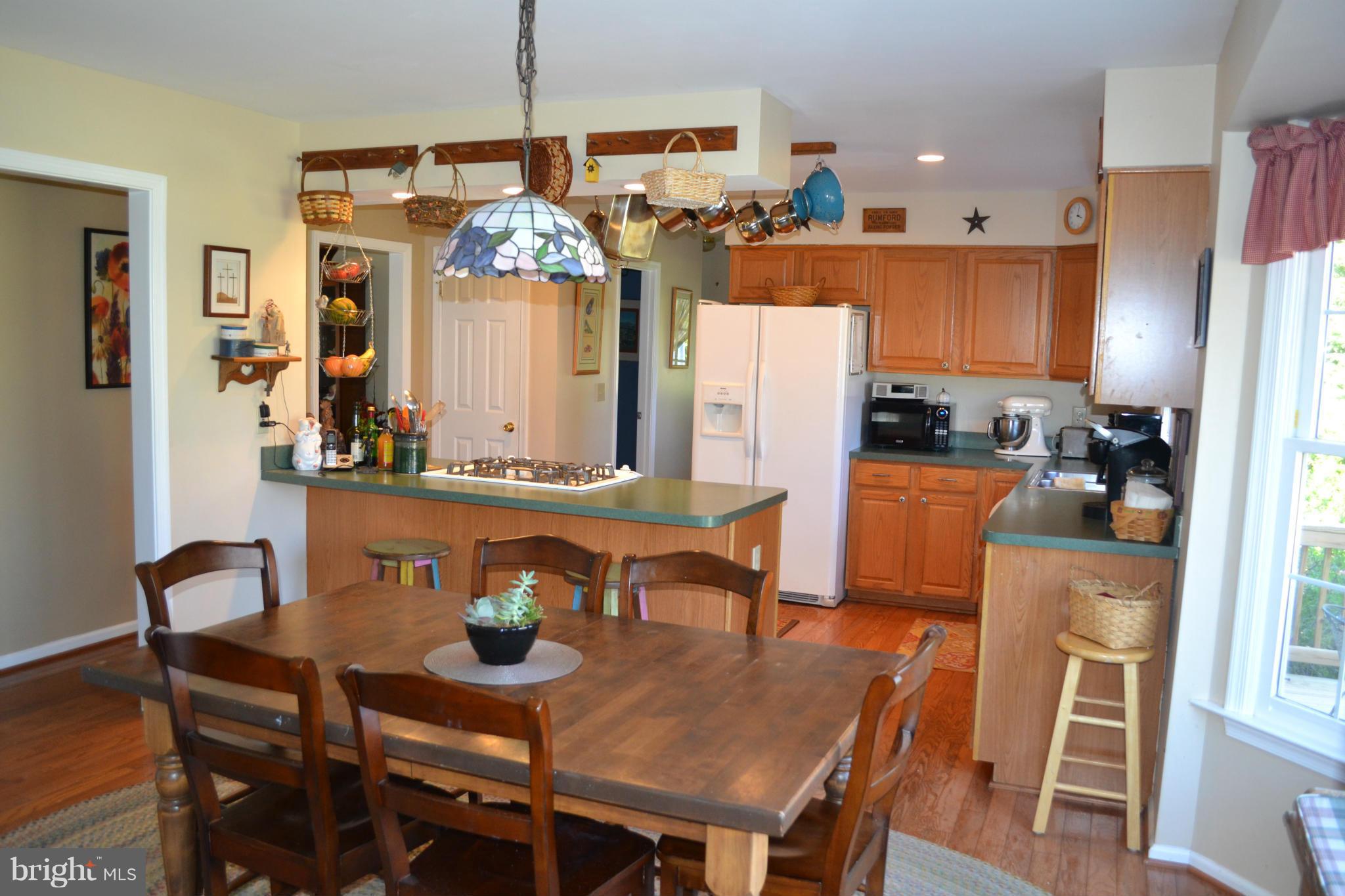 5901 Moore Road Marshall, VA 20115 - Photo 3 of 30 a dining room with furniture a chandelier and window