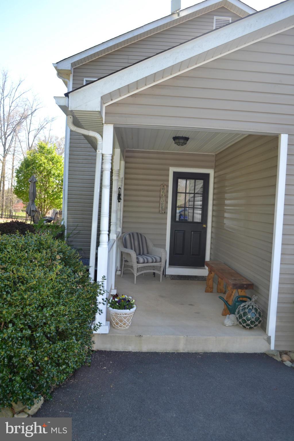 5901 Moore Road Marshall, VA 20115 - Photo 25 of 30 a view of a house with backyard and garage