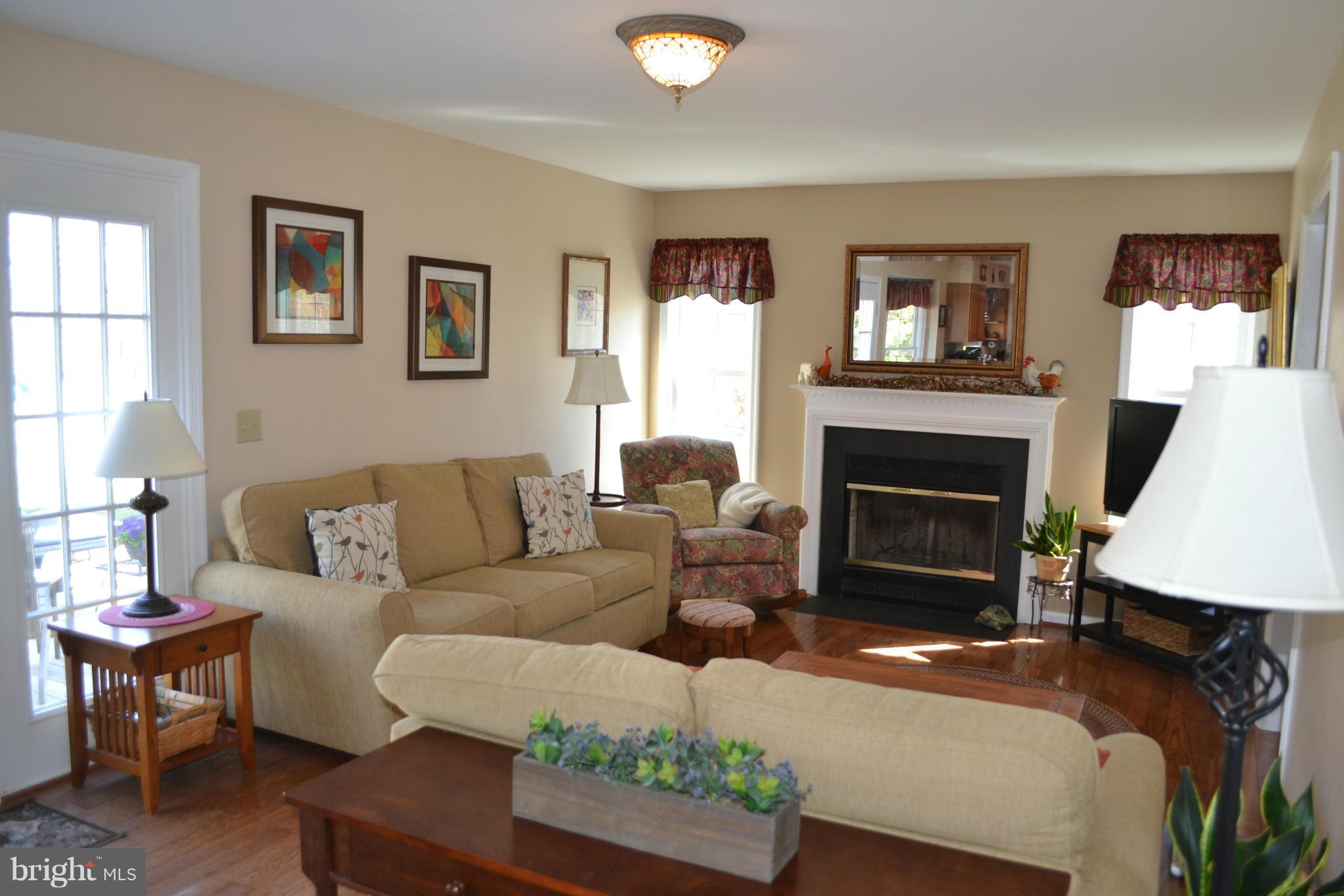 5901 Moore Road Marshall, VA 20115 - Photo 4 of 30 a living room with furniture a window and a fireplace