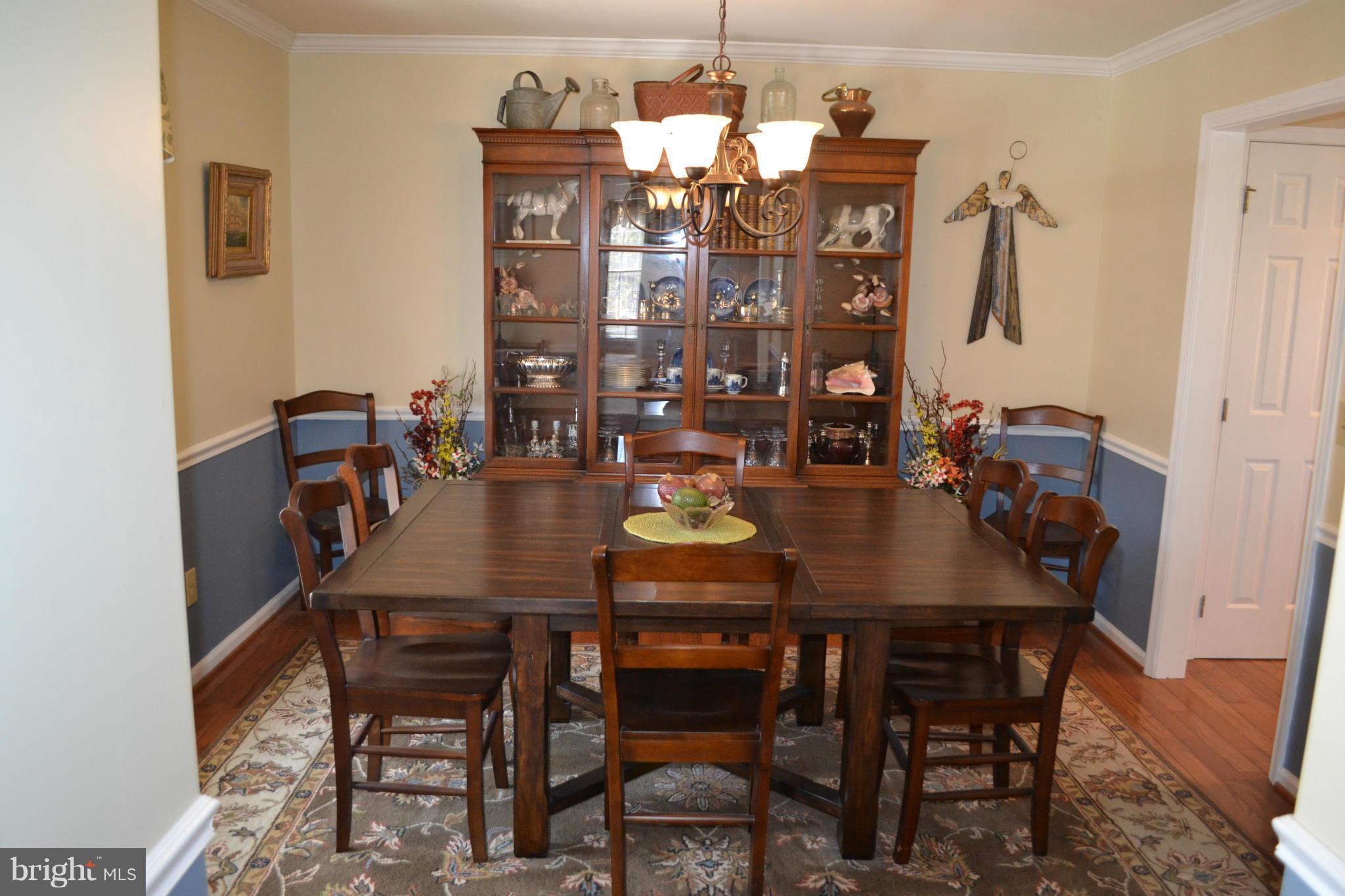 5901 Moore Road Marshall, VA 20115 - Photo 5 of 30 a view of a dining room with furniture and chandelier