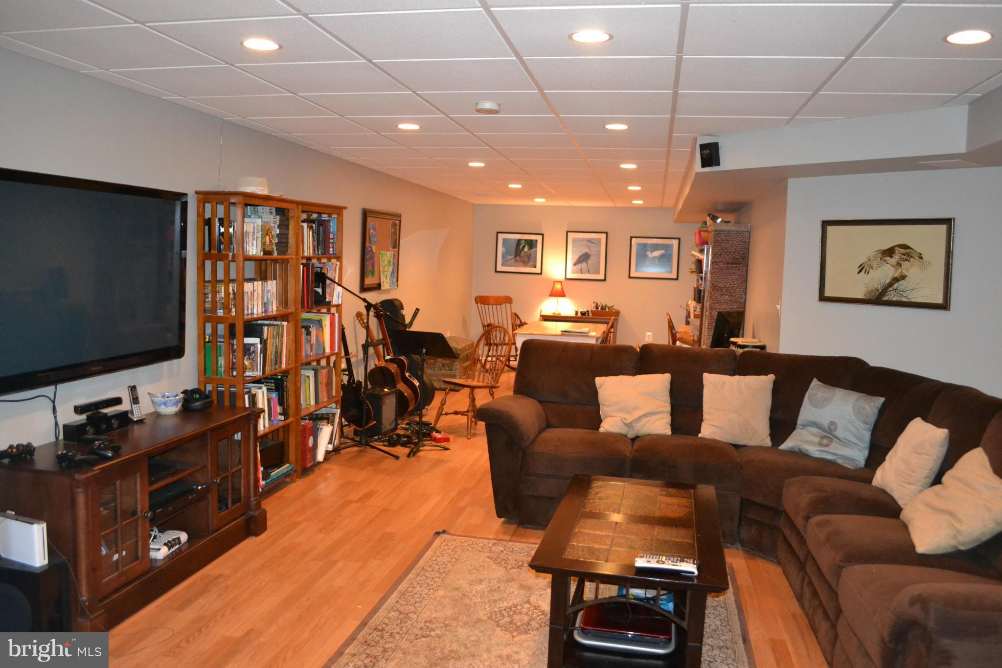 5901 Moore Road Marshall, VA 20115 - Photo 10 of 30 a living room with furniture and a flat screen tv