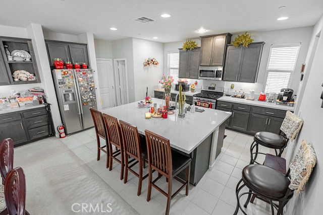 39580 Strada Pozzo Lake Elsinore, CA 92532 - Photo 20 of 67 a view of a dining room with furniture