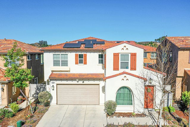 39580 Strada Pozzo Lake Elsinore, CA 92532 - Photo 2 of 67 a front view of a house with a garage