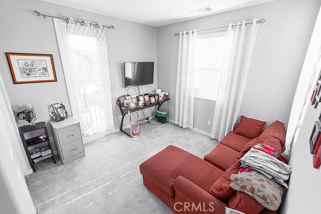 39580 Strada Pozzo Lake Elsinore, CA 92532 - Photo 30 of 67 a living room with furniture and a flat screen tv
