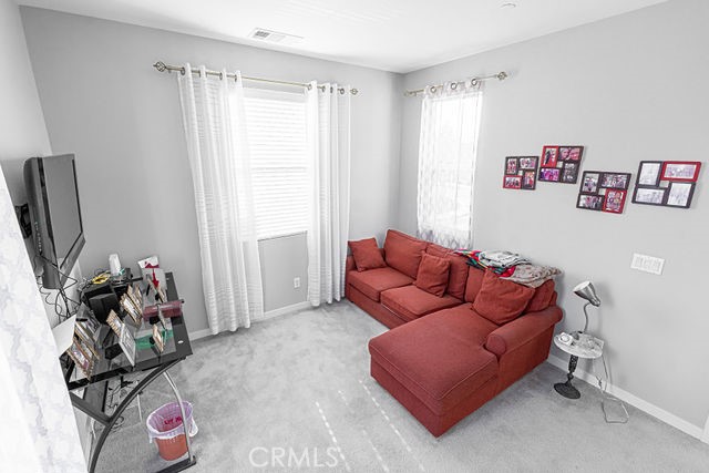 39580 Strada Pozzo Lake Elsinore, CA 92532 - Photo 31 of 67 a living room with furniture and a flat screen tv
