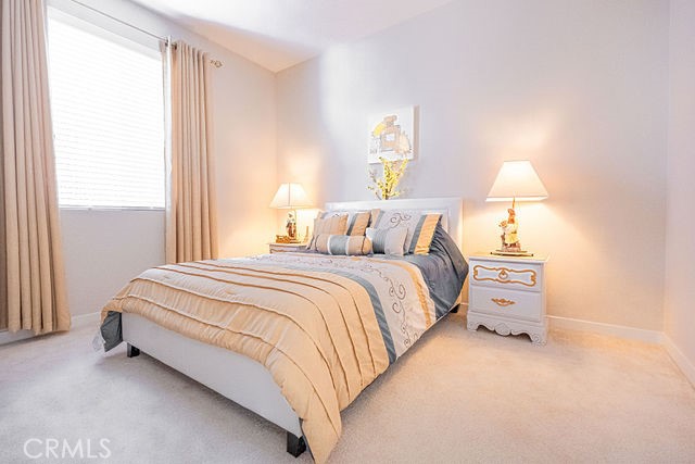 39580 Strada Pozzo Lake Elsinore, CA 92532 - Photo 44 of 67 a bedroom with a bed and a lamp