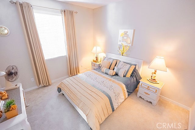 39580 Strada Pozzo Lake Elsinore, CA 92532 - Photo 45 of 67 a bedroom with a bed and a window