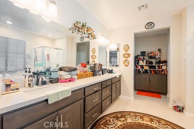 39580 Strada Pozzo Lake Elsinore, CA 92532 - Photo 47 of 67 a bathroom with a sink double vanity and mirror