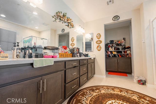 39580 Strada Pozzo Lake Elsinore, CA 92532 - Photo 48 of 67 a room with lots of counter top space and wooden floor