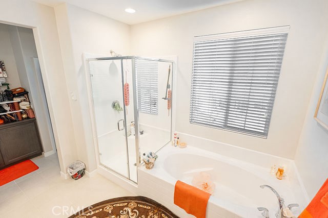 39580 Strada Pozzo Lake Elsinore, CA 92532 - Photo 50 of 67 a bathroom with a bathtub and a shower