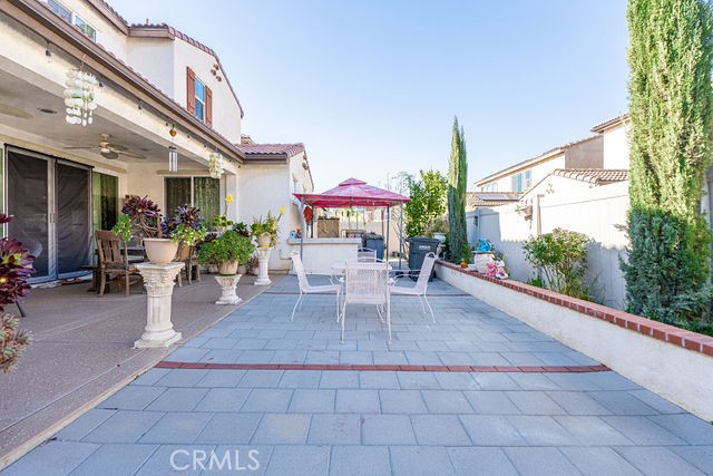 39580 Strada Pozzo Lake Elsinore, CA 92532 - Photo 55 of 67 a view of a patio with a dining table and chairs