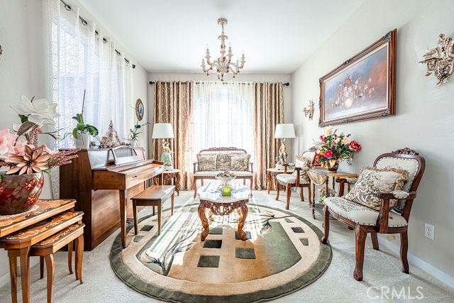 39580 Strada Pozzo Lake Elsinore, CA 92532 - Photo 7 of 67 a dining room with furniture a large window and wooden floor