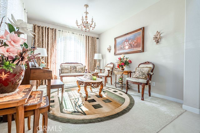 39580 Strada Pozzo Lake Elsinore, CA 92532 - Photo 9 of 67 a living room with furniture and a chandelier