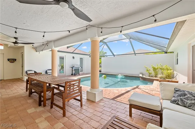 a view of a patio with a table and chairs