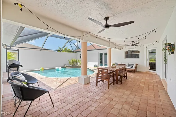 a view of an entryway with wooden floor and a rug