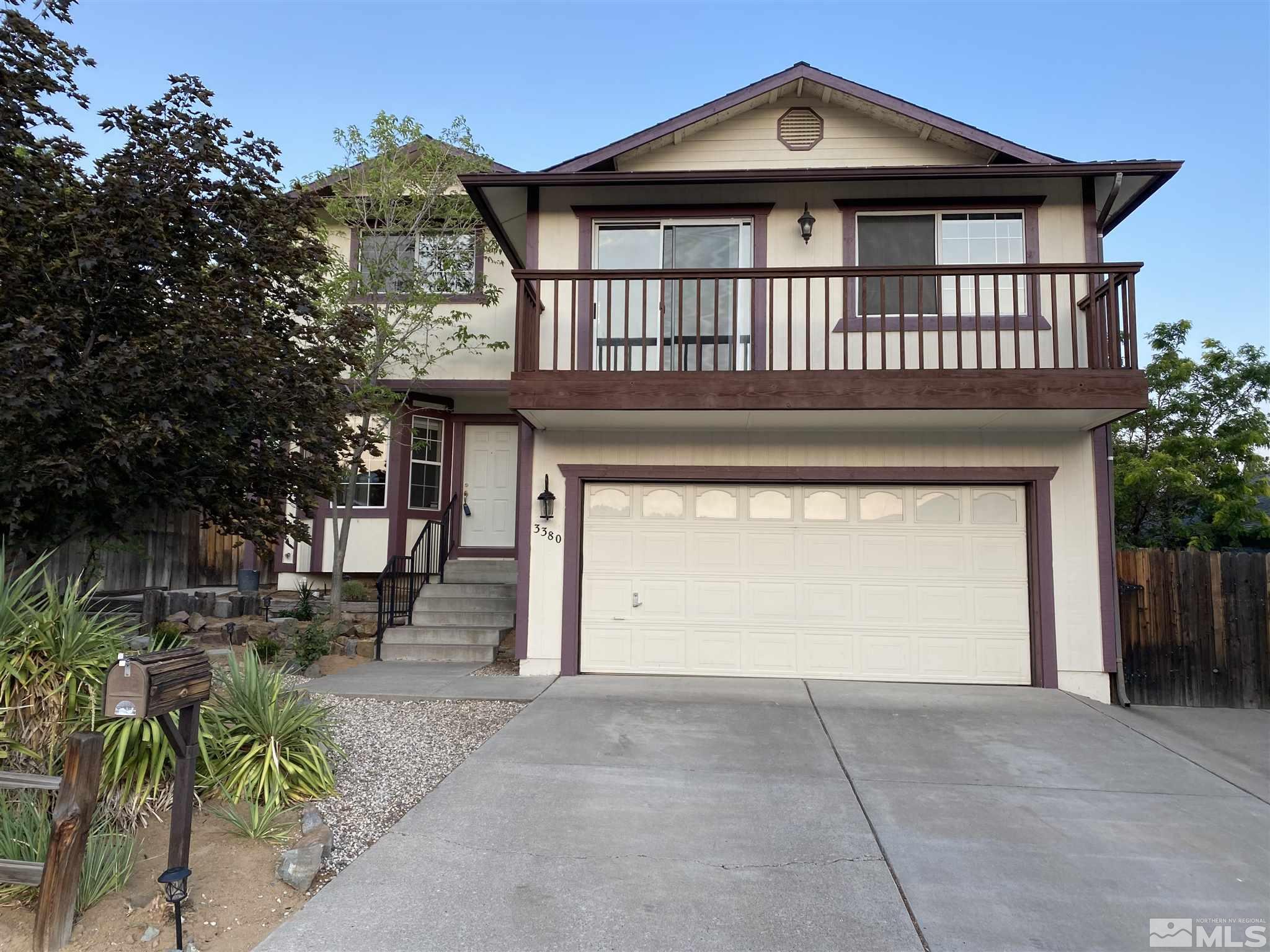 3380 Adler Court Reno, NV 89503 - Photo 1 of 30 a front view of a house with a garden