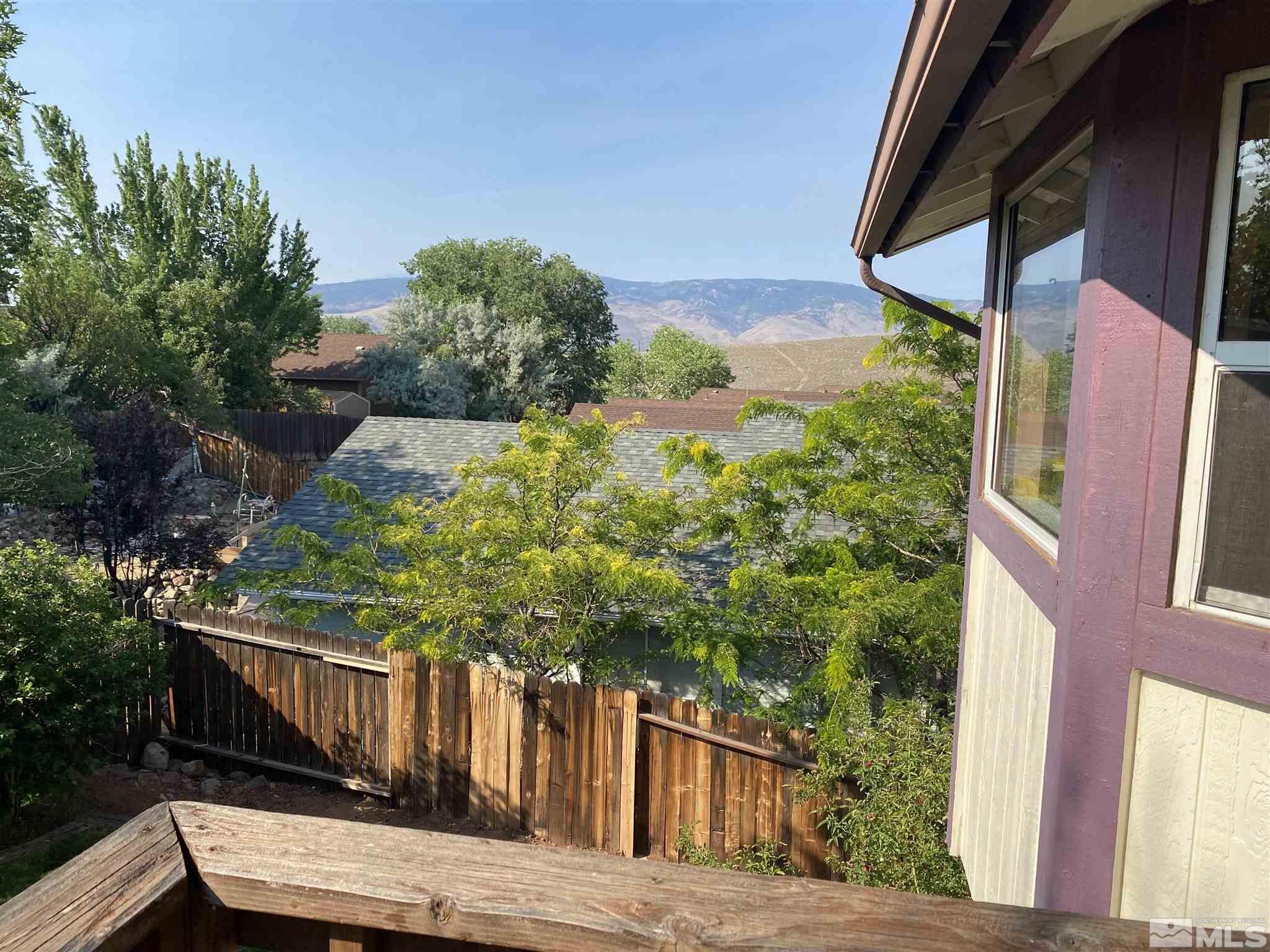 3380 Adler Court Reno, NV 89503 - Photo 20 of 30 a view of balcony with wooden floor and fence