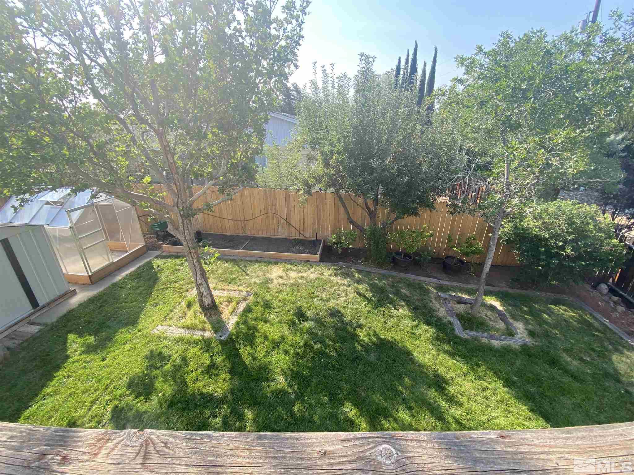 3380 Adler Court Reno, NV 89503 - Photo 27 of 30 a backyard of a house with lots of green space