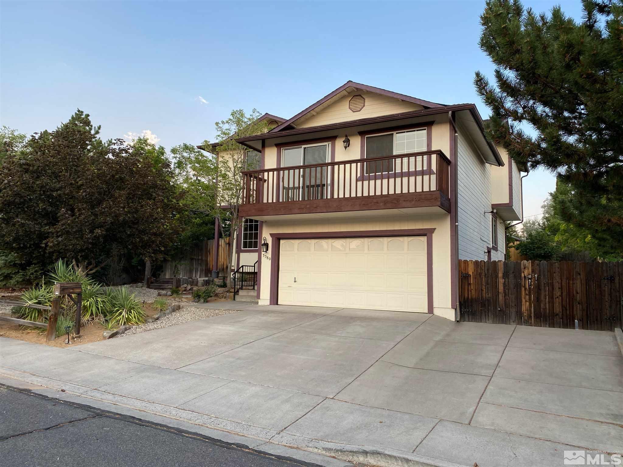 3380 Adler Court Reno, NV 89503 - Photo 28 of 30 a front view of a house with a yard and garage