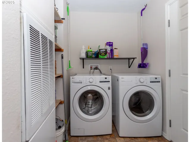 a view of wooden house with a wooden fence