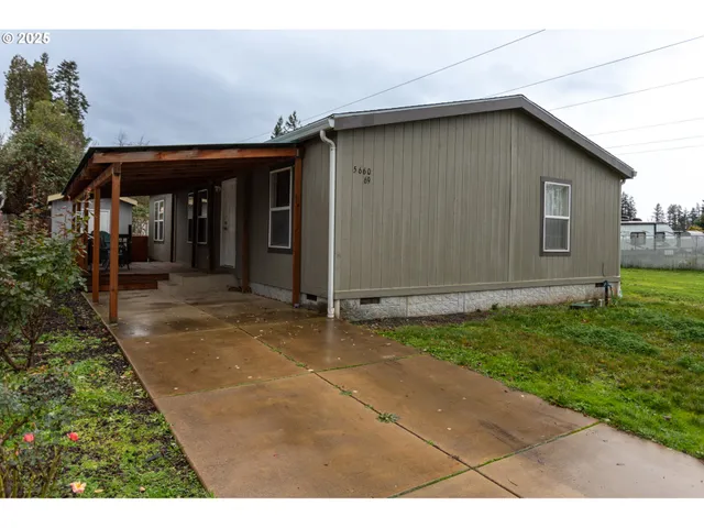 a yellow house with a outdoor space