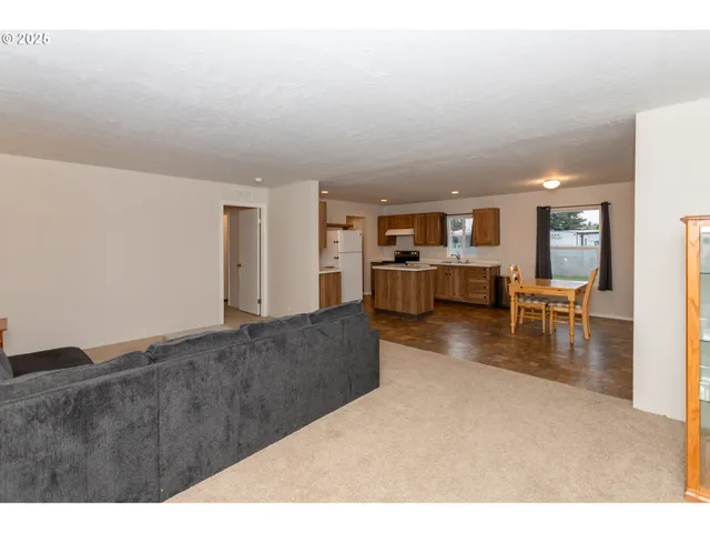 a kitchen with refrigerator and cabinets