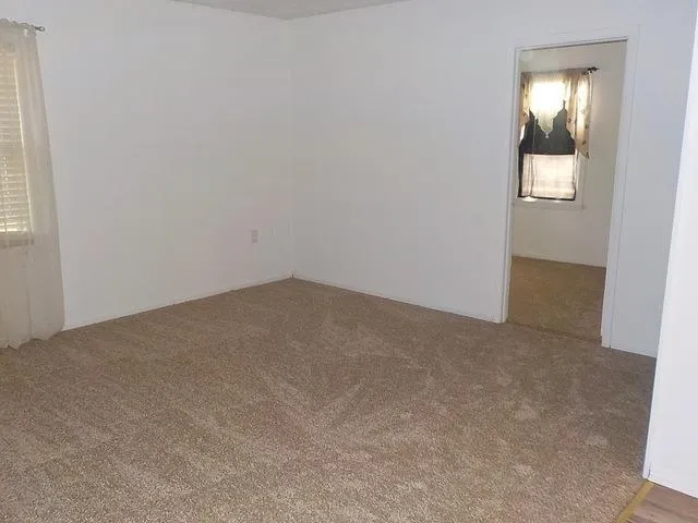 an empty room with mirror