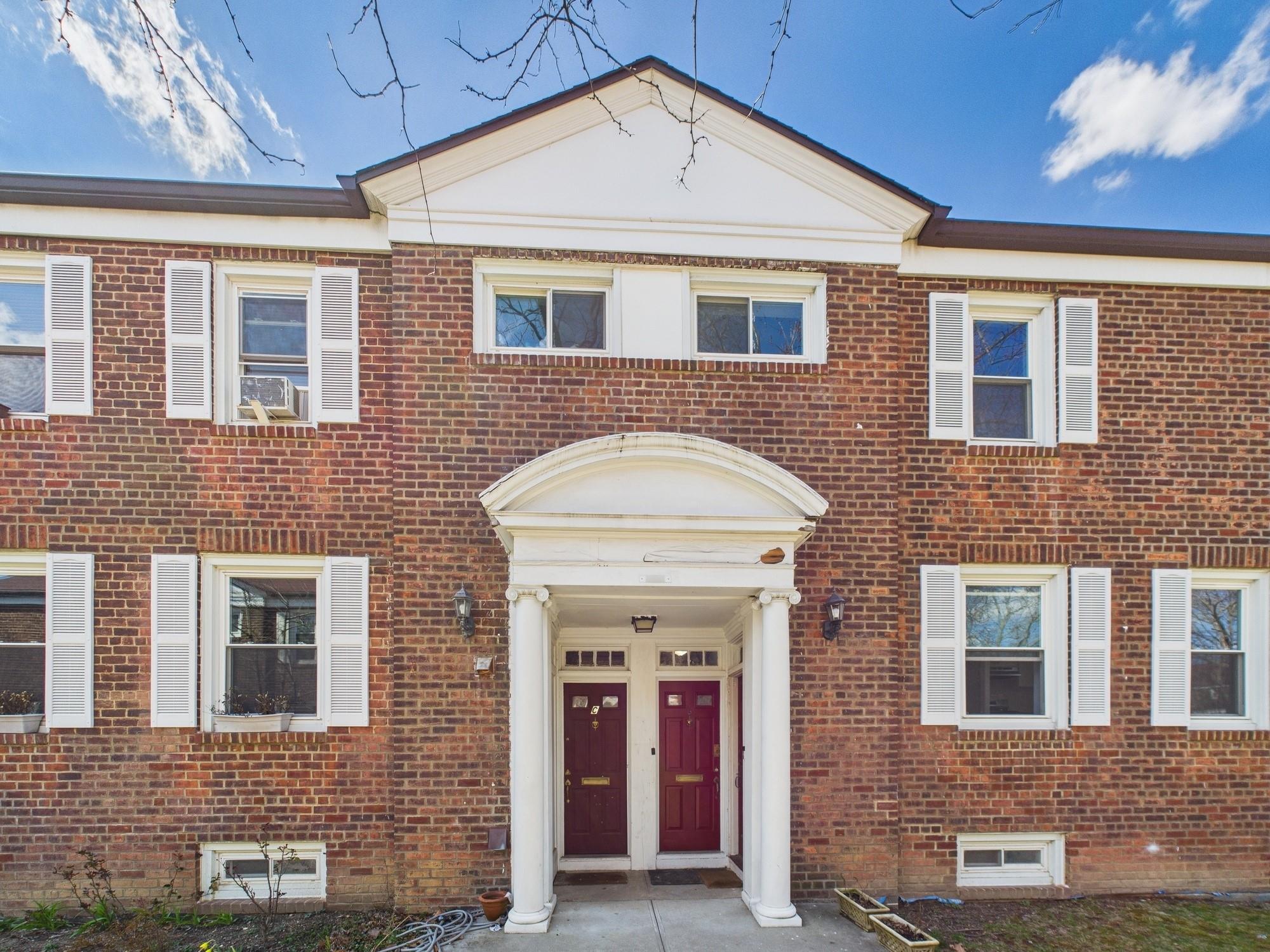 147-20 Village Road, Unit 80D Queens, NY 11435 - Photo 1 of 1 View of front of property featuring brick siding