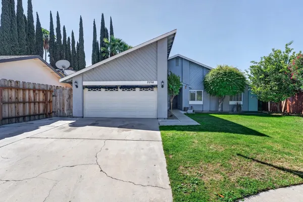 a view of a back yard of the house