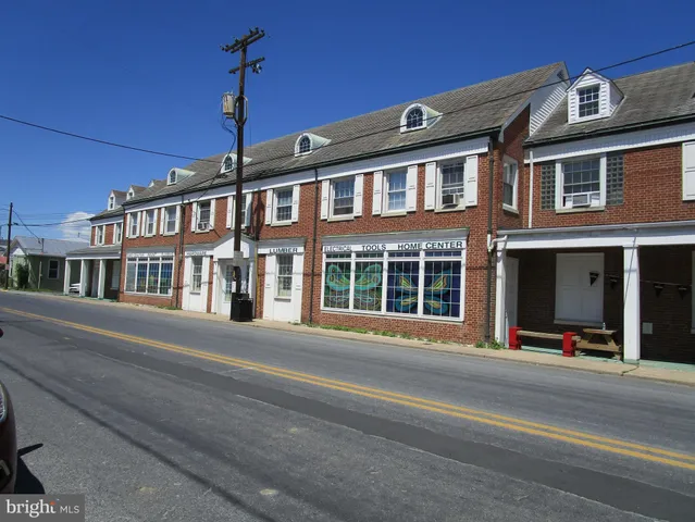 a front view of a building with street view