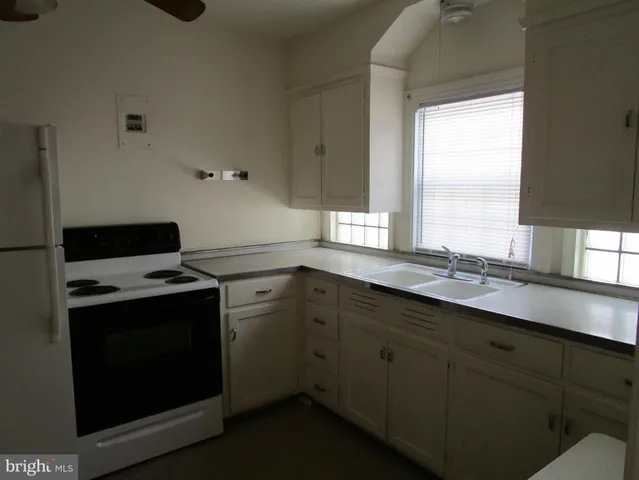 a kitchen with a stove and a sink
