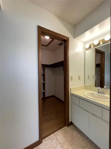 a bathroom with a double vanity sink and mirror