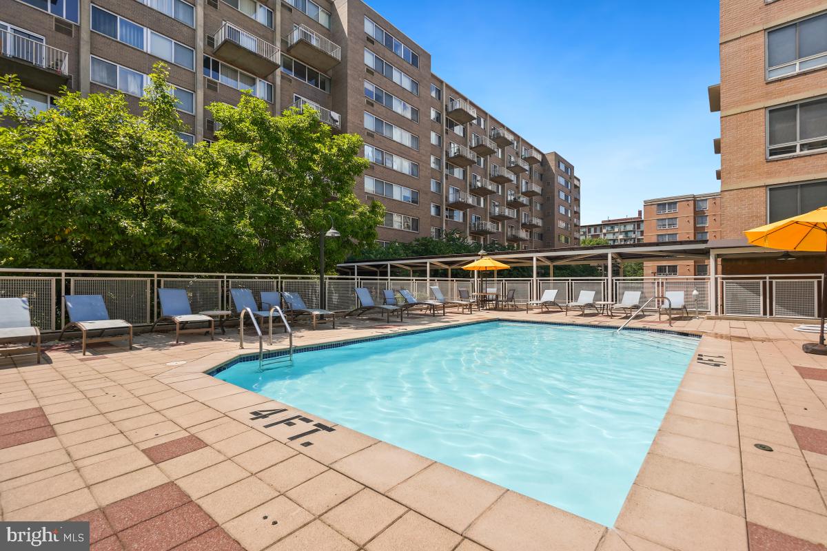 800 4th Street Southwest, Unit N301 Washington, DC 20024 - Photo 25 of 31 a view of a swimming pool with a lounge chair