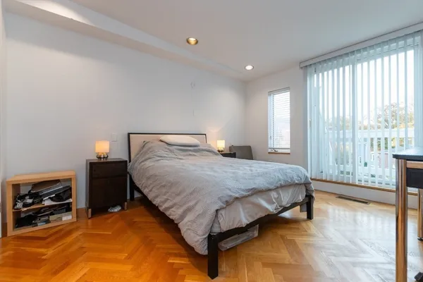 a bedroom with a bed and a view of bedroom