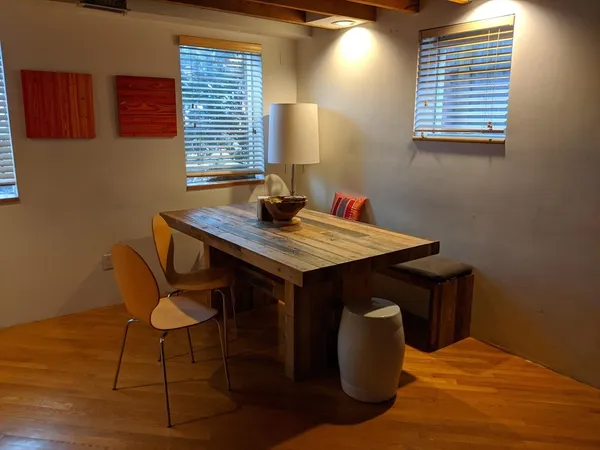 a dining room with a table and chairs