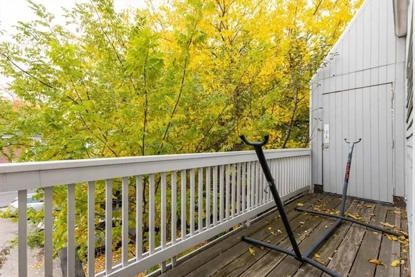 a view of a balcony with wooden floor