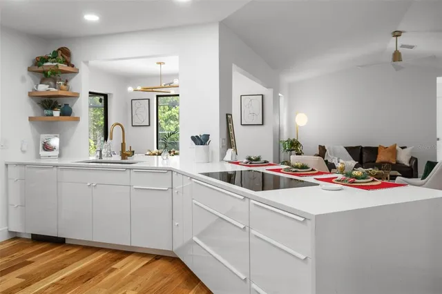 a kitchen with a sink and cabinets