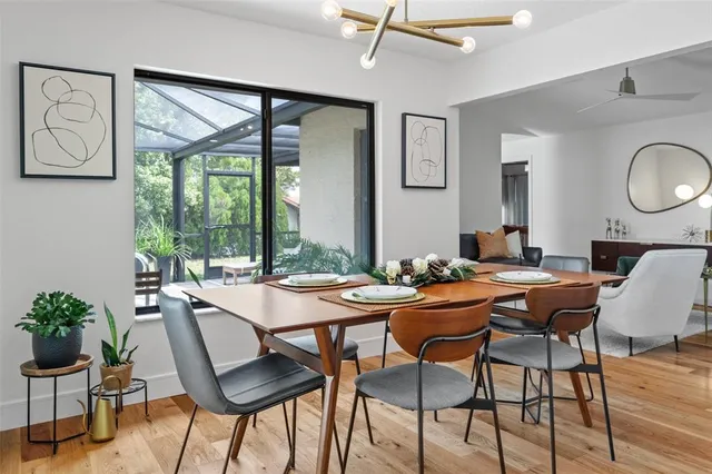 a view of a dining room with furniture window and outside view