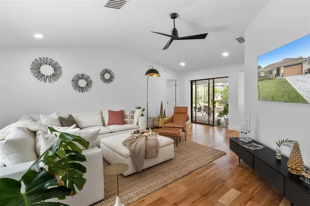 a living room with furniture and a large window