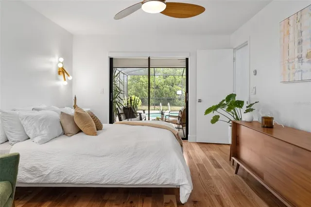 a bedroom with a bed running cycle and a window