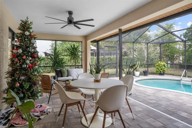 a dining room with furniture window and outside view