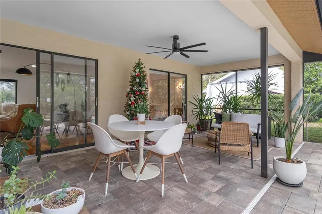 a view of a dining room with furniture window and outside view