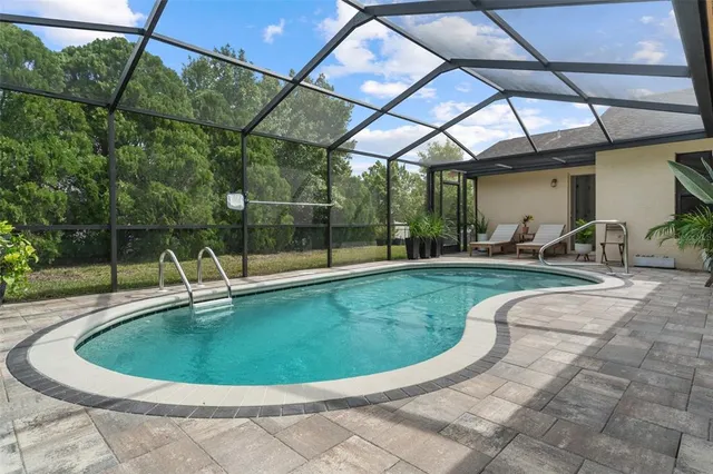a view of a swimming pool with a patio