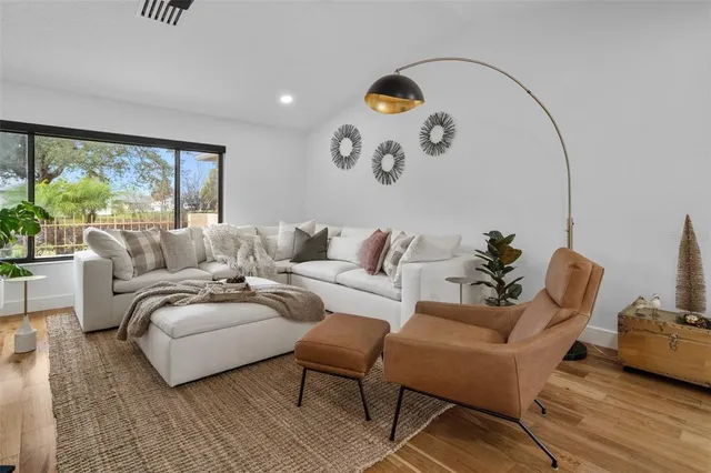 a living room with furniture and a large window