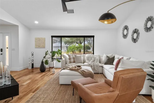 a living room with furniture and a large window