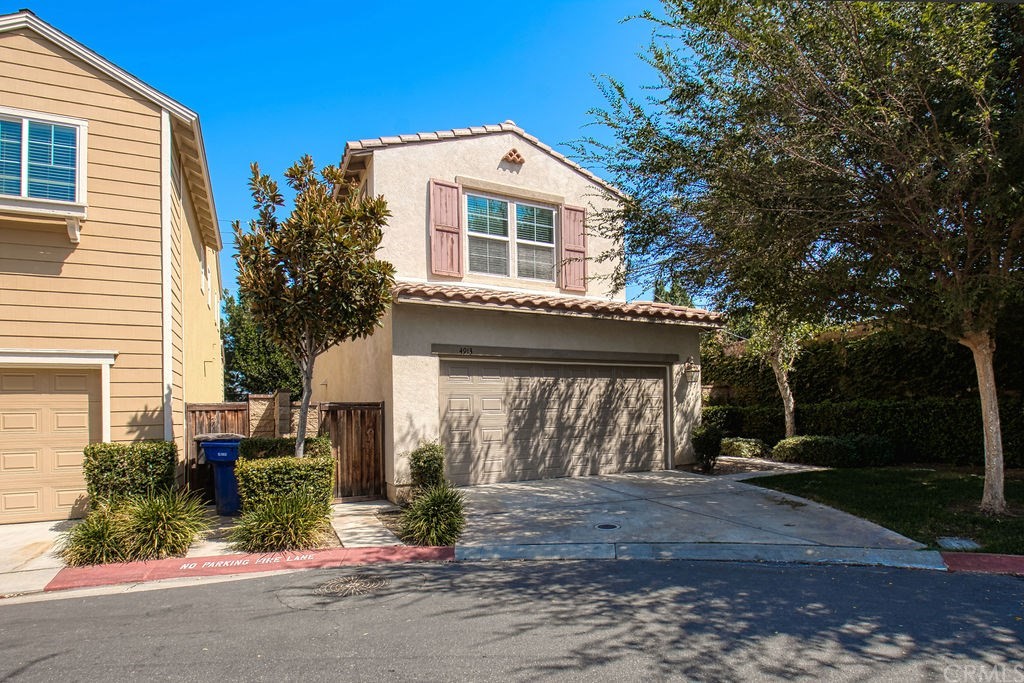 4913 Locomotive Lane Riverside, CA 92504 - Photo 1 of 1 Driveway, 2 car garage (back of house)