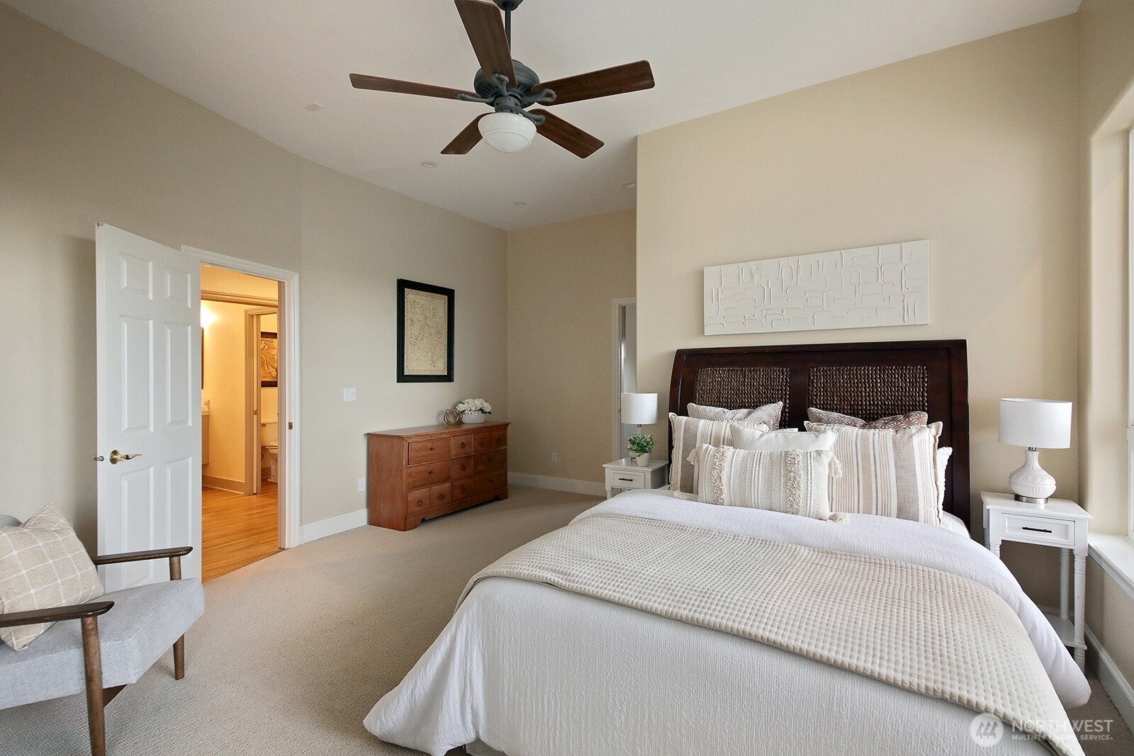 4694 Wrightsman Place Clinton, WA 98236 - Photo 28 of 38 a bedroom with a bed and wooden floor