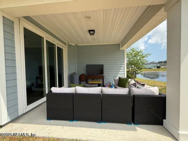 a outdoor living space with furniture and garden view
