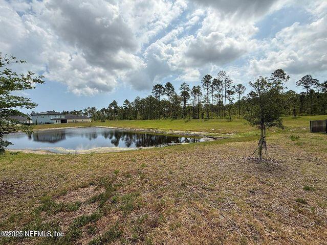 195 Torres Trace St. Augustine, FL 32095 - Photo 21 of 23 a view of a lake with houses in back